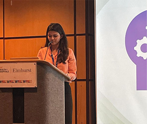 Speaker presenting at a healthcare collaboration event